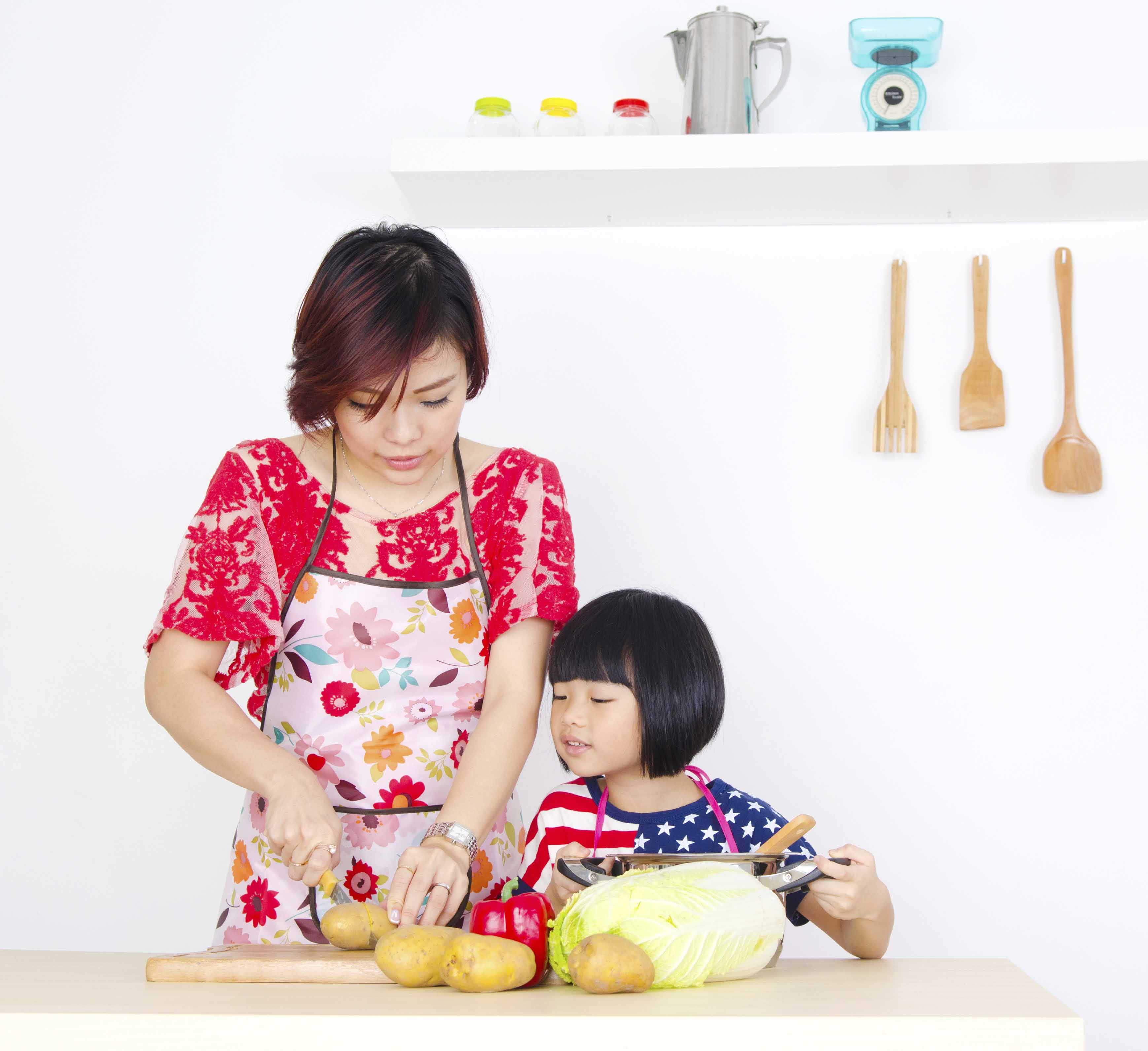 Mother and Daughter cooking together