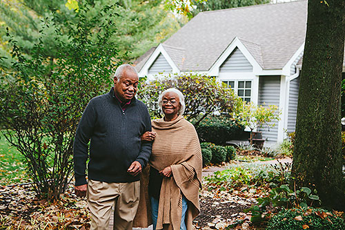 Senior couple walking outside
